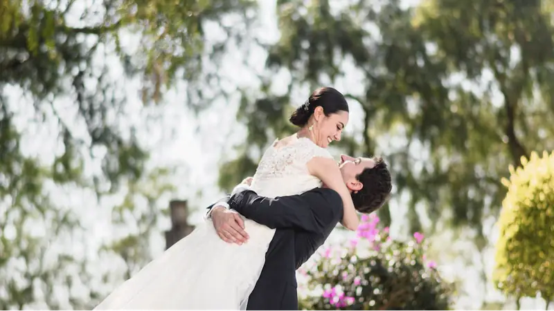 Photographer shooting a newlywed couple